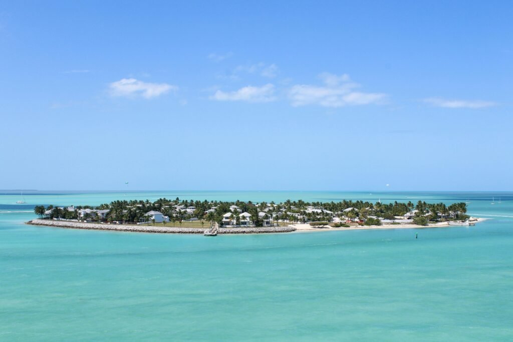 Scenic aerial shot of Key West's lush islands against a clear blue sky and sea.
