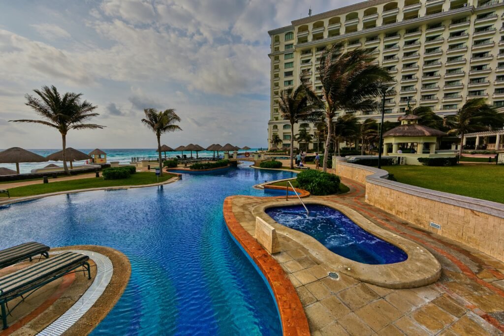 Idyllic tropical luxury resort with ocean views and pool in Cancun, Mexico.