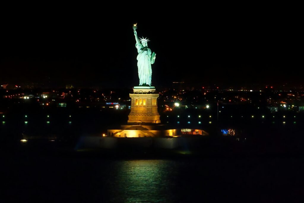 Stunning night view of the illuminated Statue of Liberty in New York City.