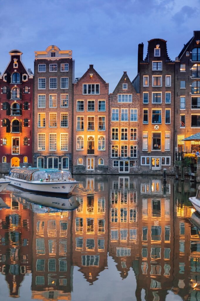 buildings, architecture, river, illuminated, reflection, mirror image, mirroring, boat, sailing, cruise, river cruise, phone wallpaper, amsterdam, nature, city, evening, night time, lights, netherlands, holland, water, sky, ship, tourism, amstelpark, amsterdam-buitenveldert, houses, aesthetic wallpaper, iphone wallpaper