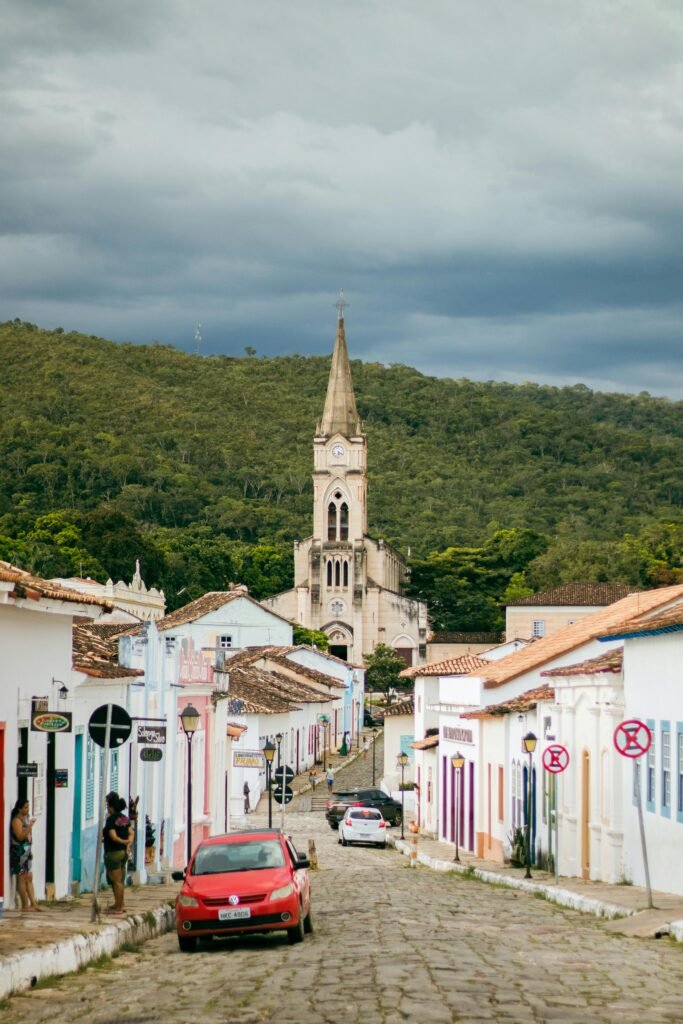Idyllic view of a cobblestone street leading to a church in historic Goiás, Brazil.